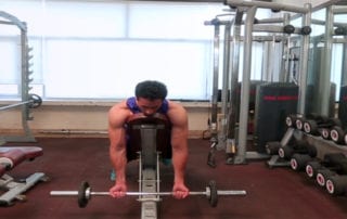 Barbell Lying On Incline Bench Curl Exercise
